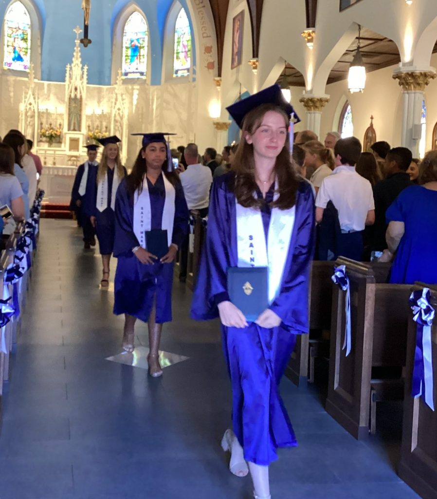 Class of 2024 walking out of St. mary Chruch