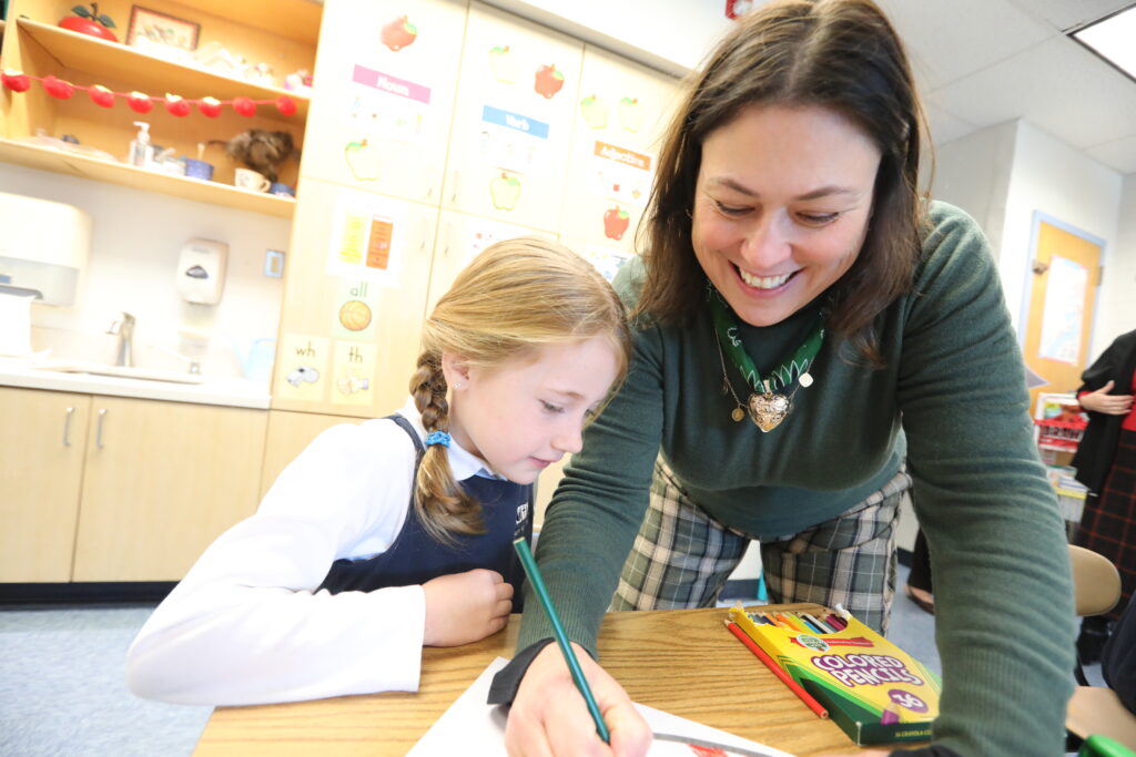 Smiling Teacher with Elem School Student
