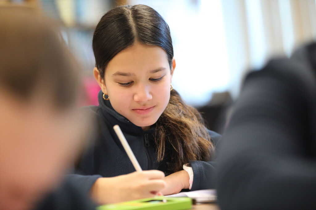 Grade 5 student working at desk