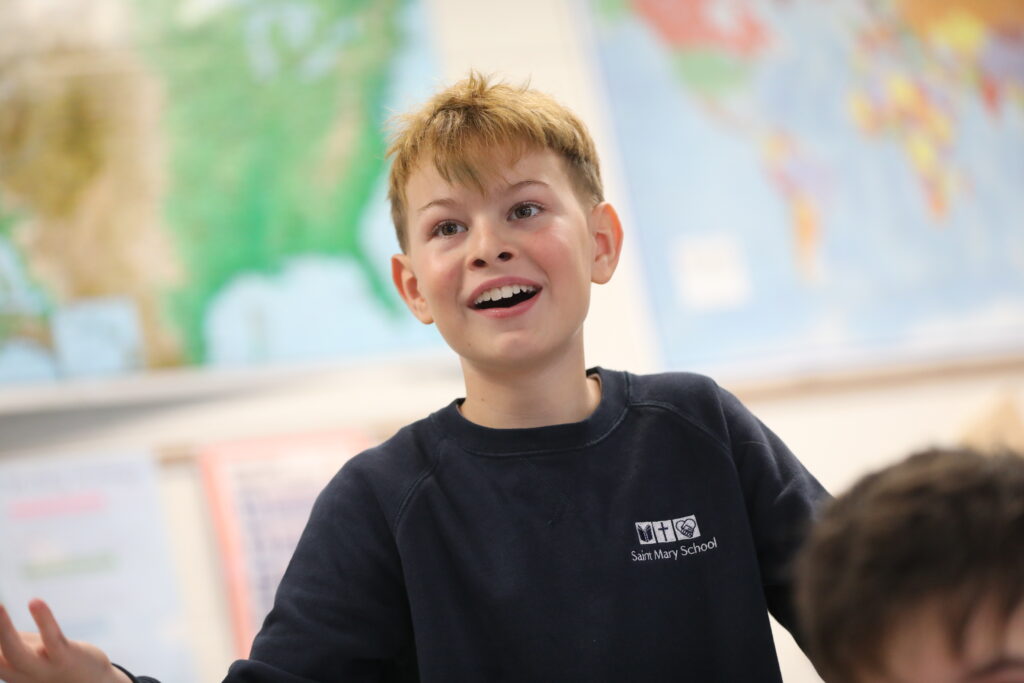 Boy in front of colorful map