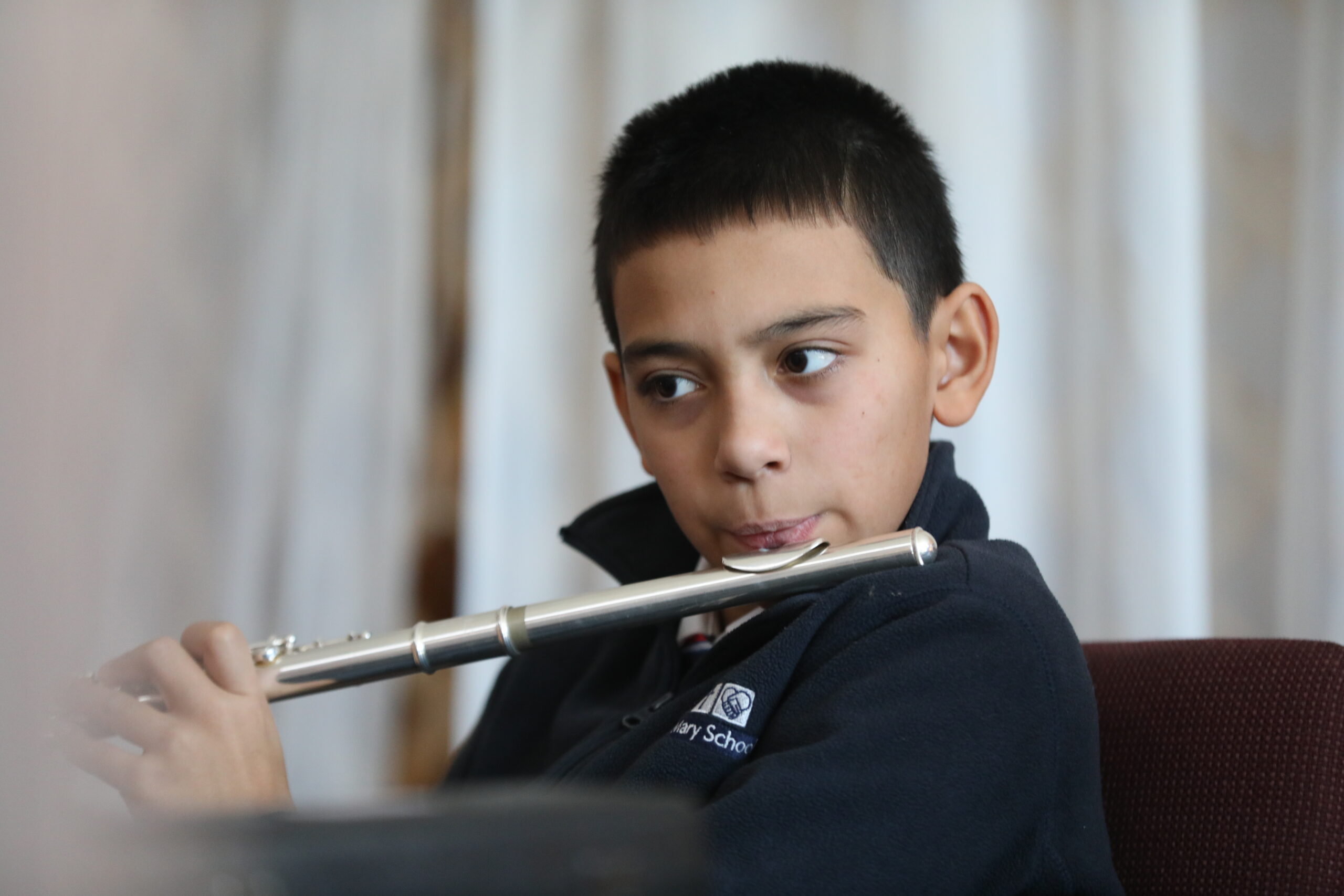 Middle School Boy playing flute
