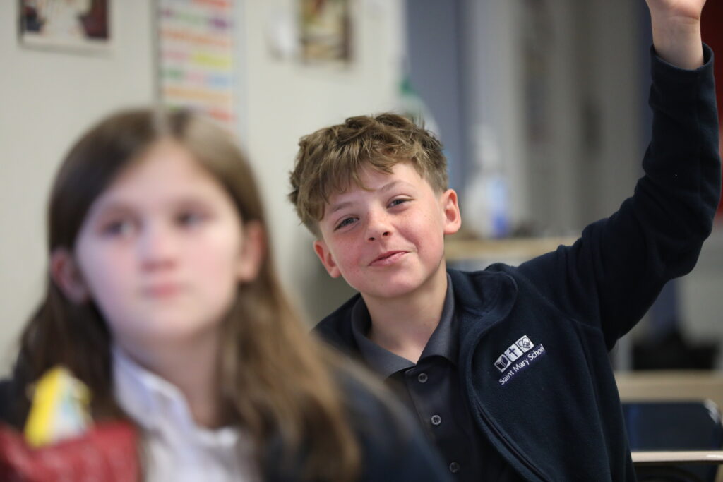 Boy raising his hand