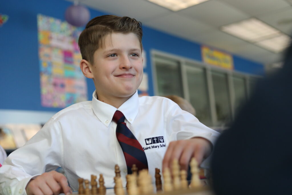 Grade 4 boy playing chess