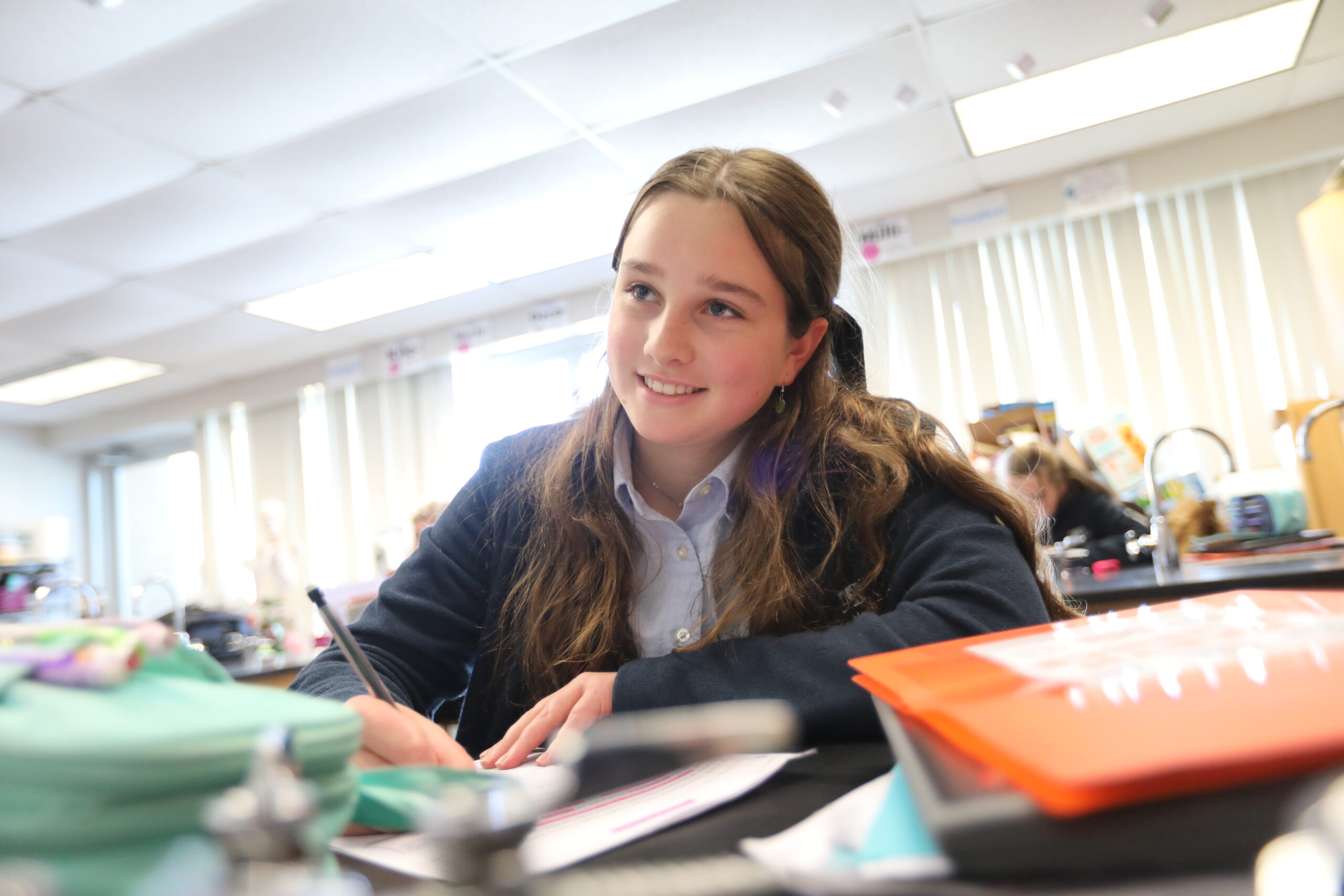 Middle School Girl Reflecting in Science Class