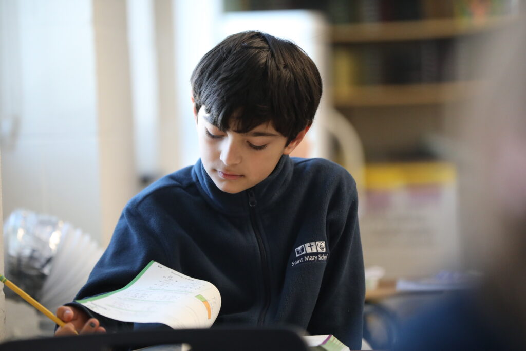 student looking at work