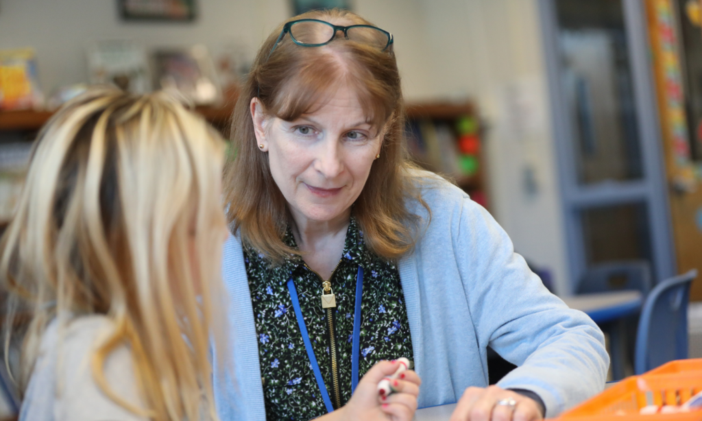 Mrs. Tappan helping a student